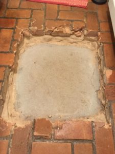 Repairing a Brick Floor…Two Steps (or Holes) Forward!
